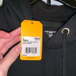 Brand new with tags, mens black logo sleeve Carhartt hoodie.